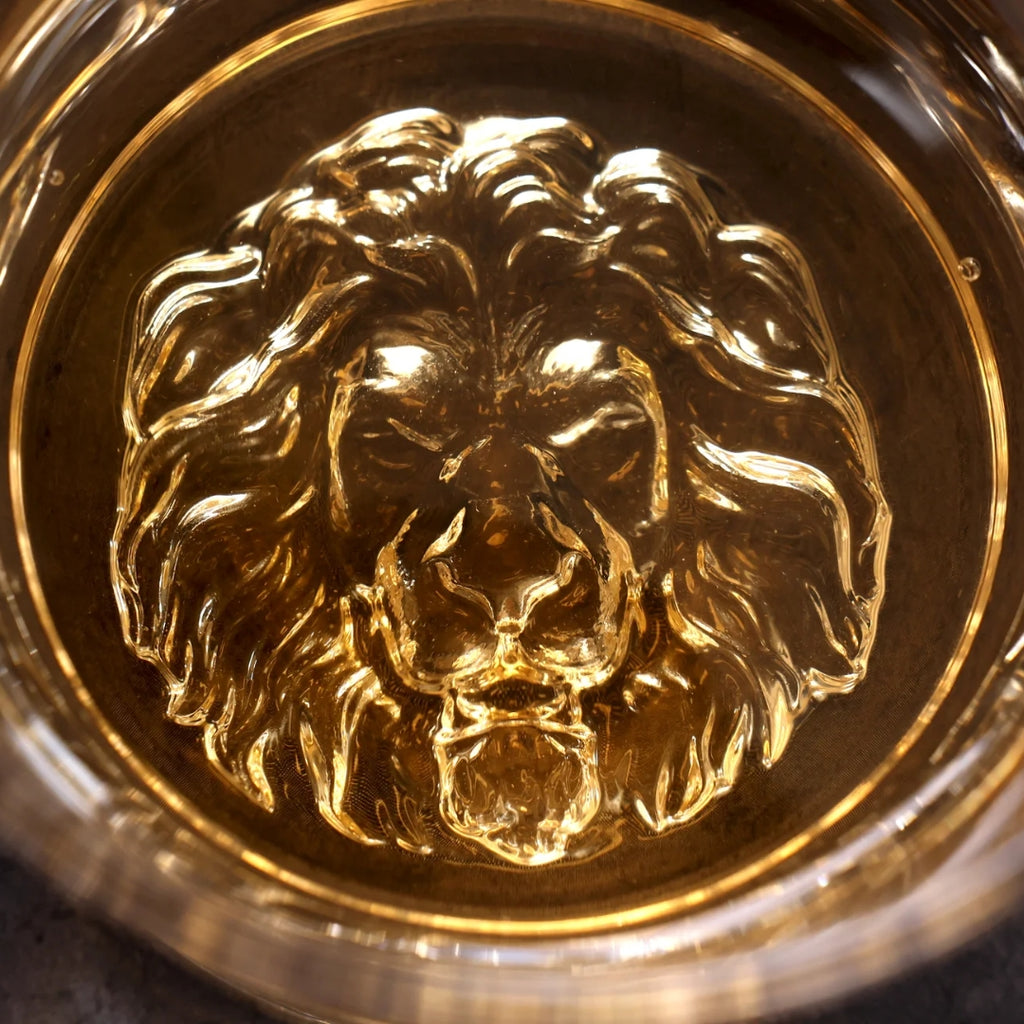 Lion whiskey glass Unique whiskey glass Whiskey tumbler with lion design Collectible lion themed whiskey glass Novelty whiskey glass Lion head whiskey glass Lion engraved whiskey glass Lion motif whiskey tumbler Lion-shaped whiskey glass Lion emblem whiskey glass