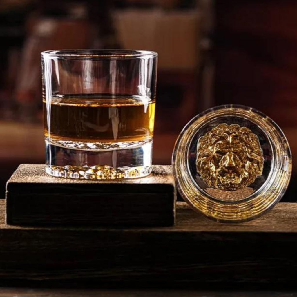 Lion whiskey glass Unique whiskey glass Whiskey tumbler with lion design Collectible lion themed whiskey glass Novelty whiskey glass Lion head whiskey glass Lion engraved whiskey glass Lion motif whiskey tumbler Lion-shaped whiskey glass Lion emblem whiskey glass