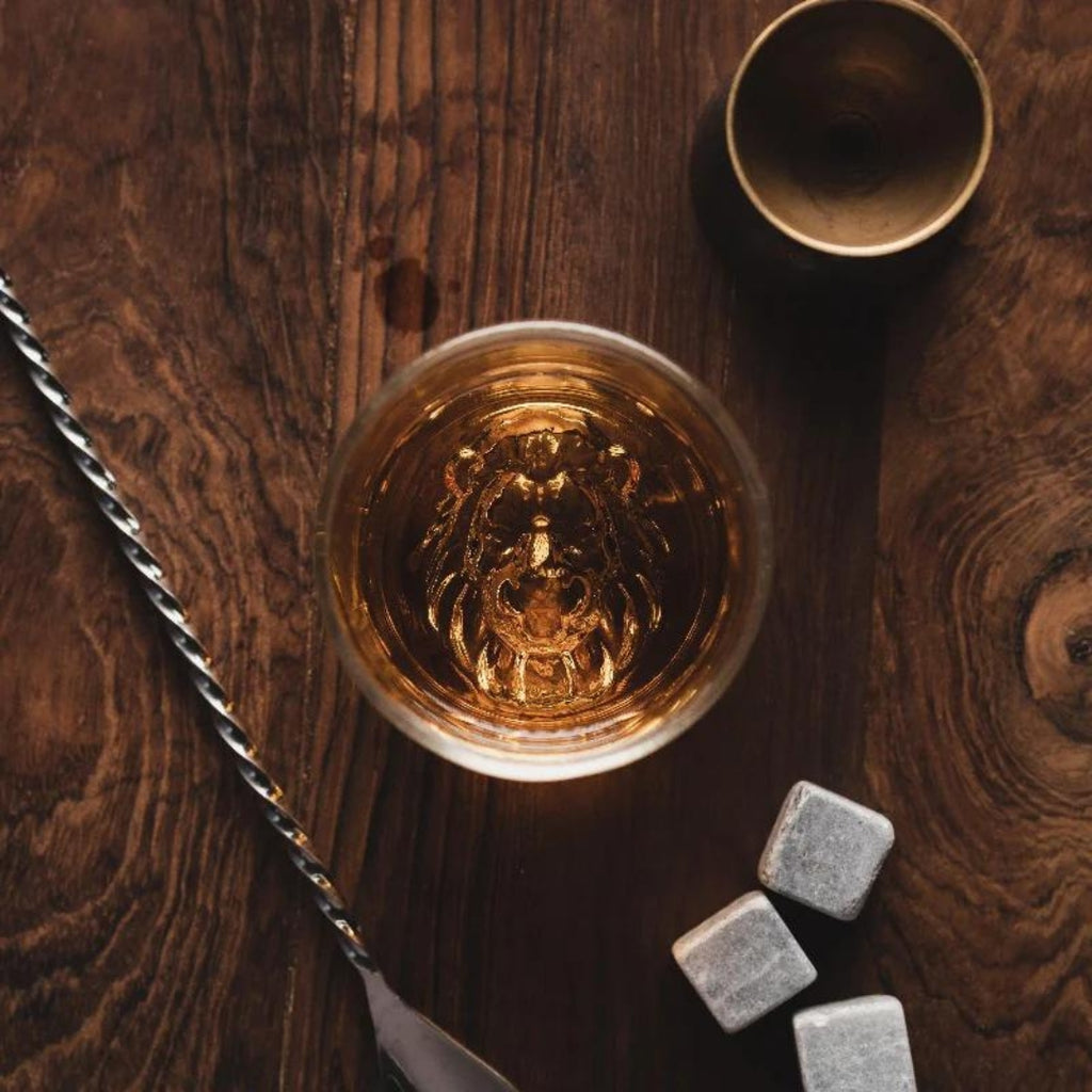 Lion whiskey glass Unique whiskey glass Whiskey tumbler with lion design Collectible lion themed whiskey glass Novelty whiskey glass Lion head whiskey glass Lion engraved whiskey glass Lion motif whiskey tumbler Lion-shaped whiskey glass Lion emblem whiskey glass