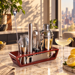 Cocktail shaker set in a wooden display stand on a marble kitchen island